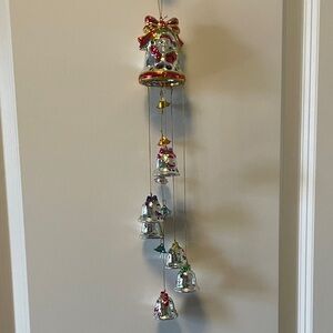 A mid-1990s to early-2000s blown-glass style Santa bell decor